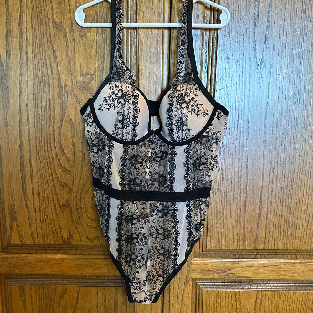 Frederick’s of Hollywood nude and black bodysuit